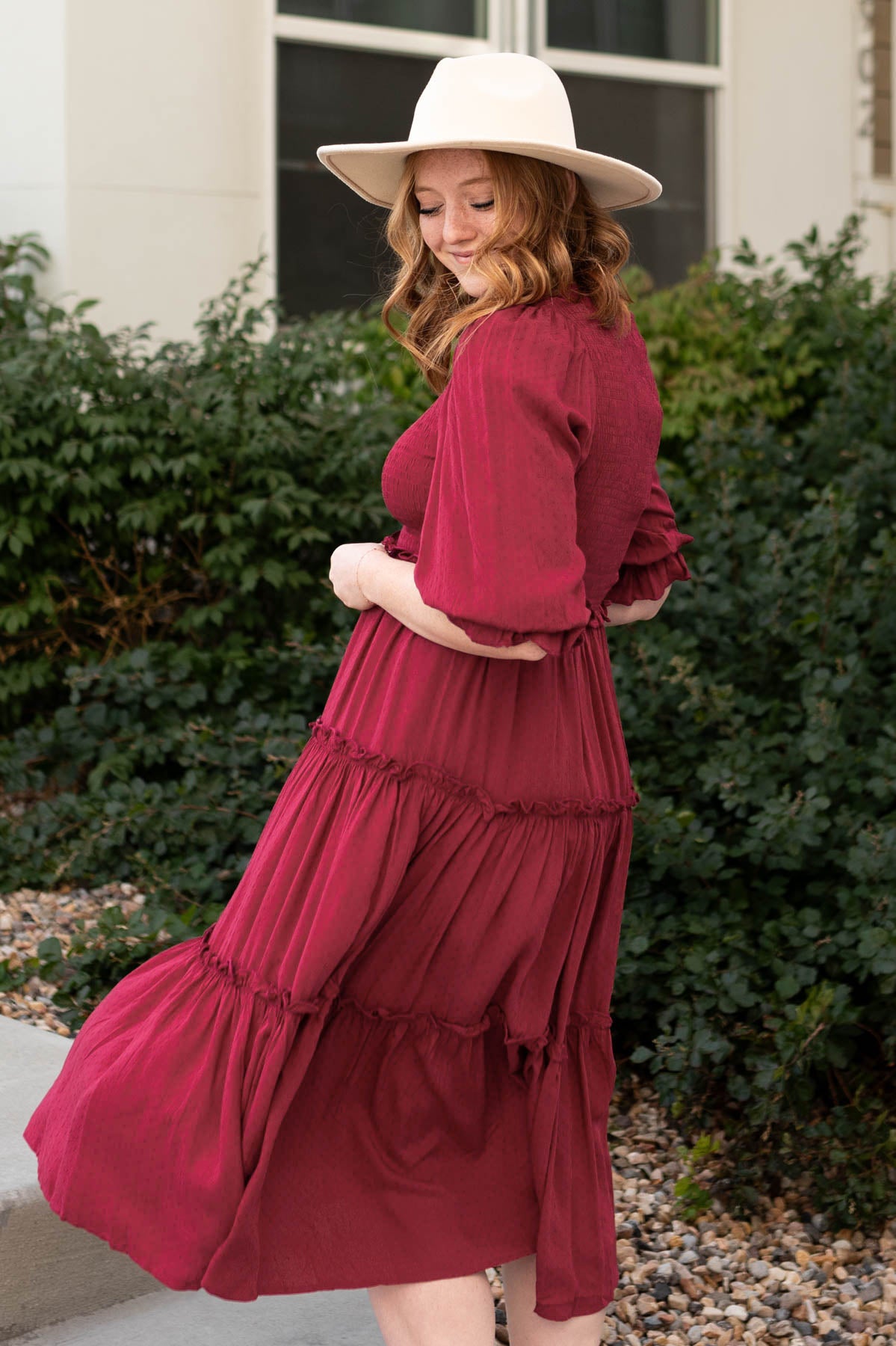 Side view of a deep red dress