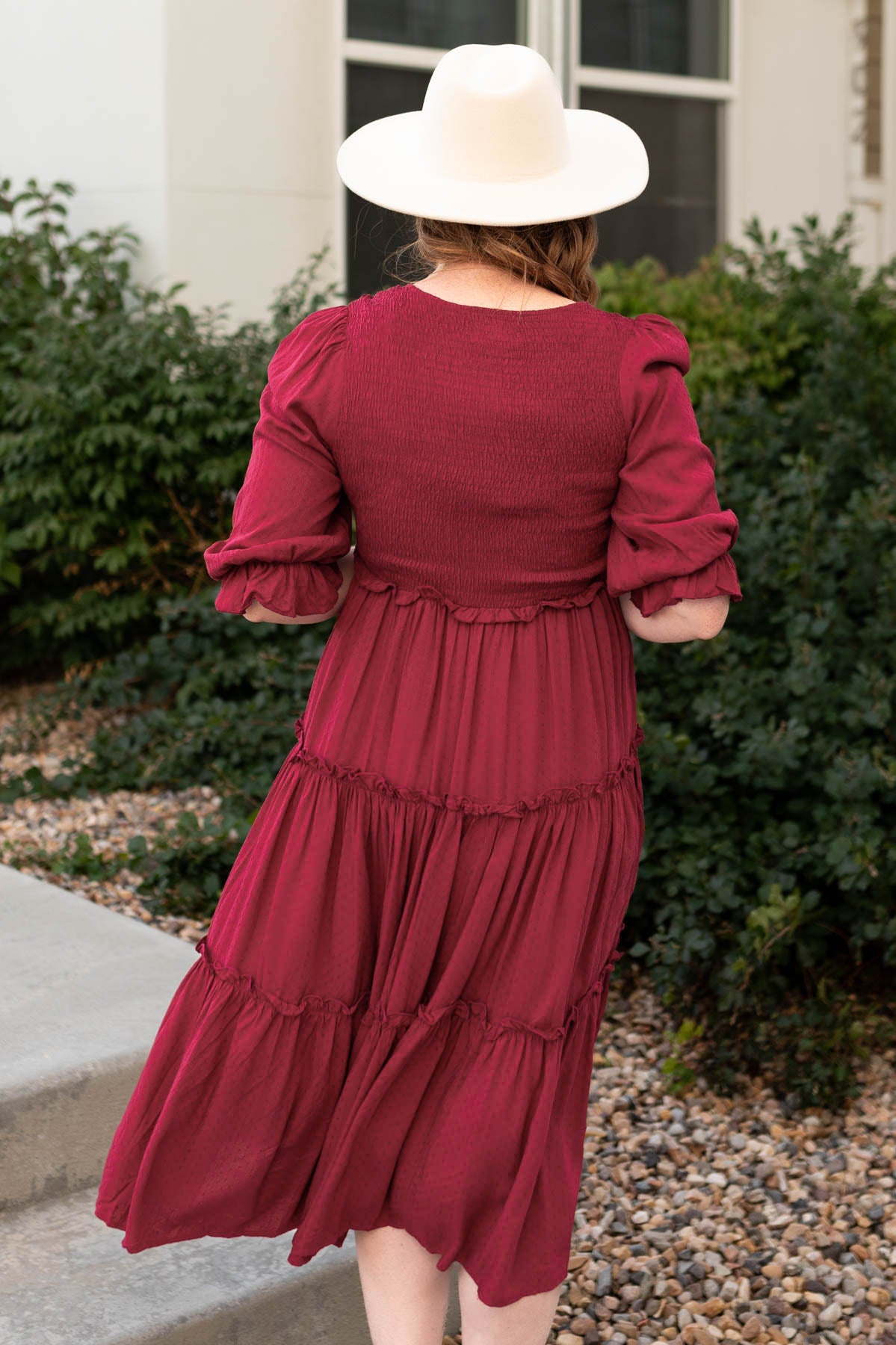 Back view of a deep red dress