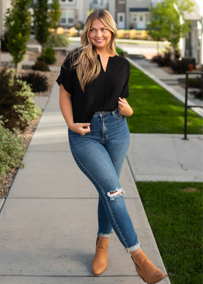 Short sleeve black top with a v-cut in the neck