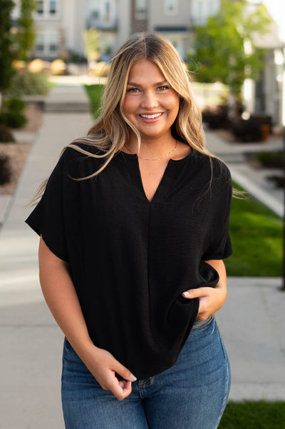 Front view of a short sleeve black top