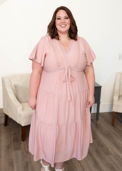 Plus size blush textured tiered dress with lace on the bodice and a high waist tie.