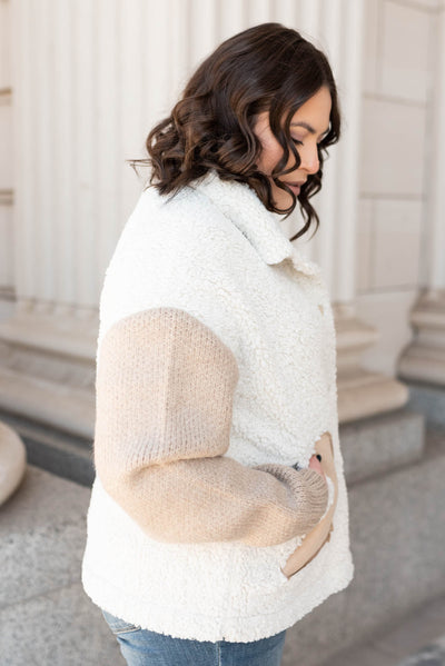 Side view of the taupe fur sueded jacket in plus size