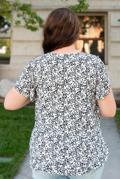 Back view of the plus size black floral top