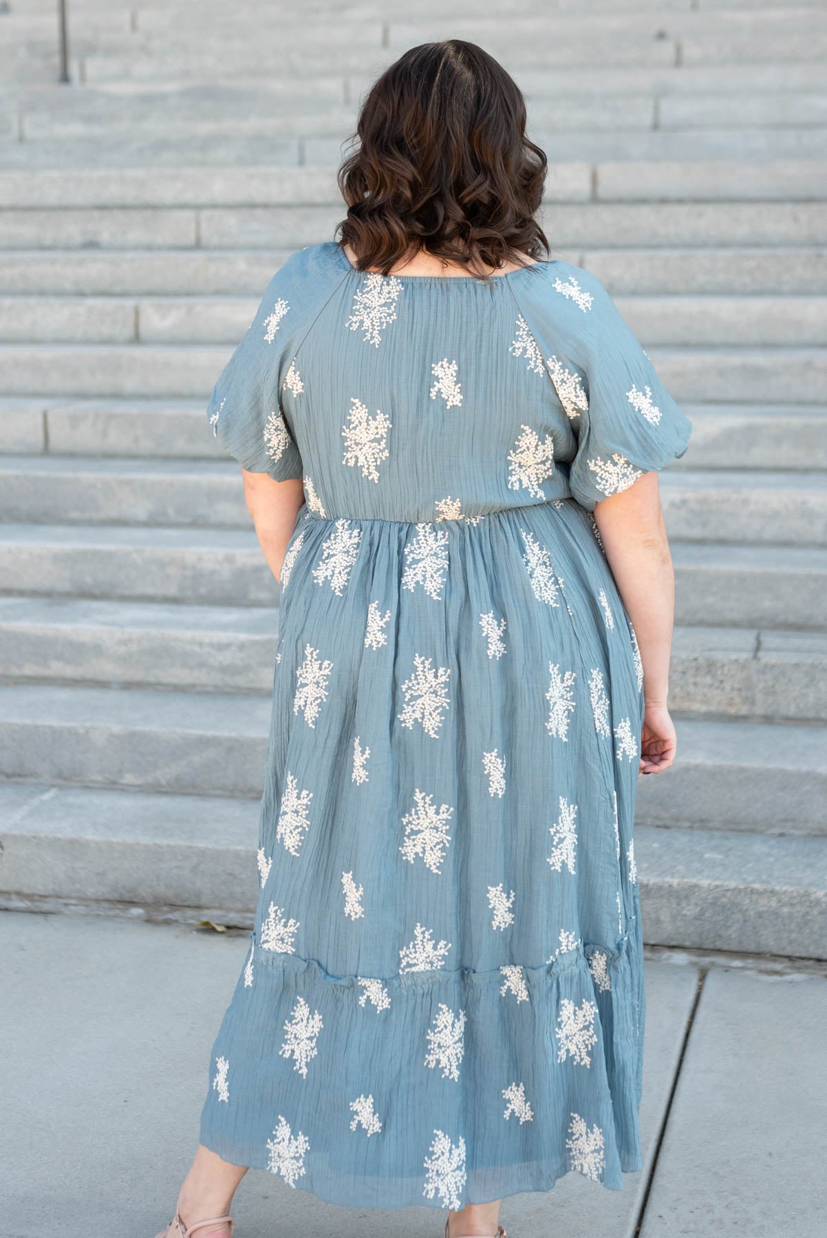 Back view of the plus size dusty blue embroidered dress