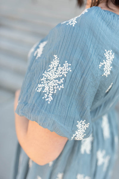 Close up of the sleeve on the plus size dusty blue embroidered dress