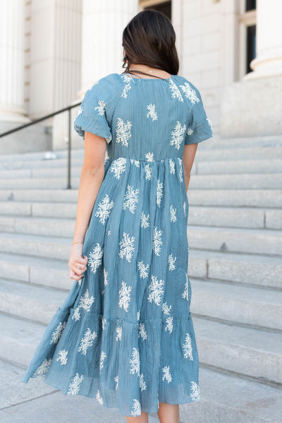 Back view of the dusty blue embroidered dress