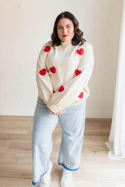 Plus size red heart cream sweater with long sleeves