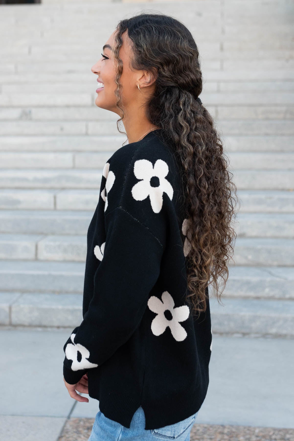 Side view of the black floral sweater