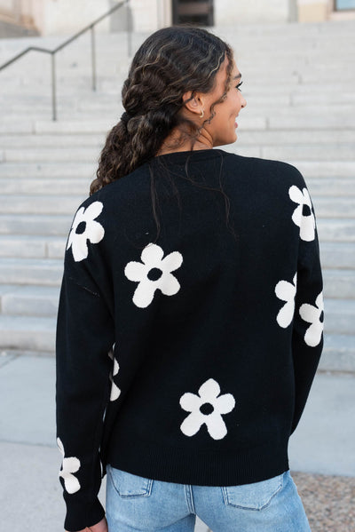 Back view of the black floral sweater