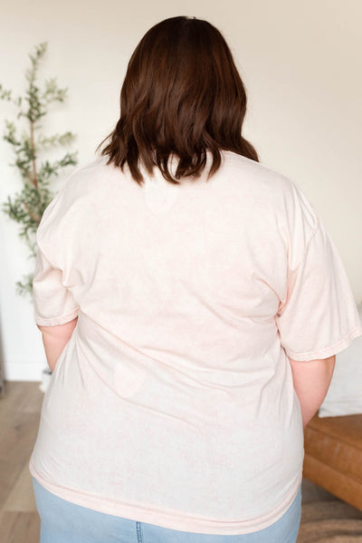 Back view of the plus size light pink ribbon graphic tee