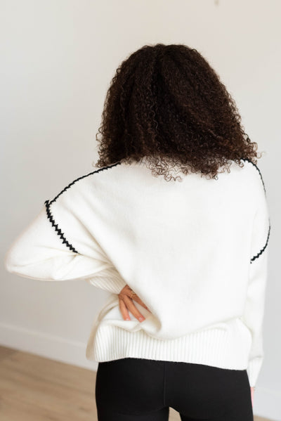 Back view of the ivory knit sweater