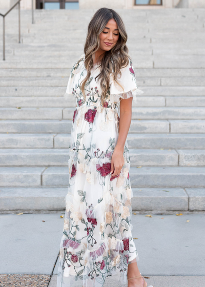 Side view of the cream floral mesh dress