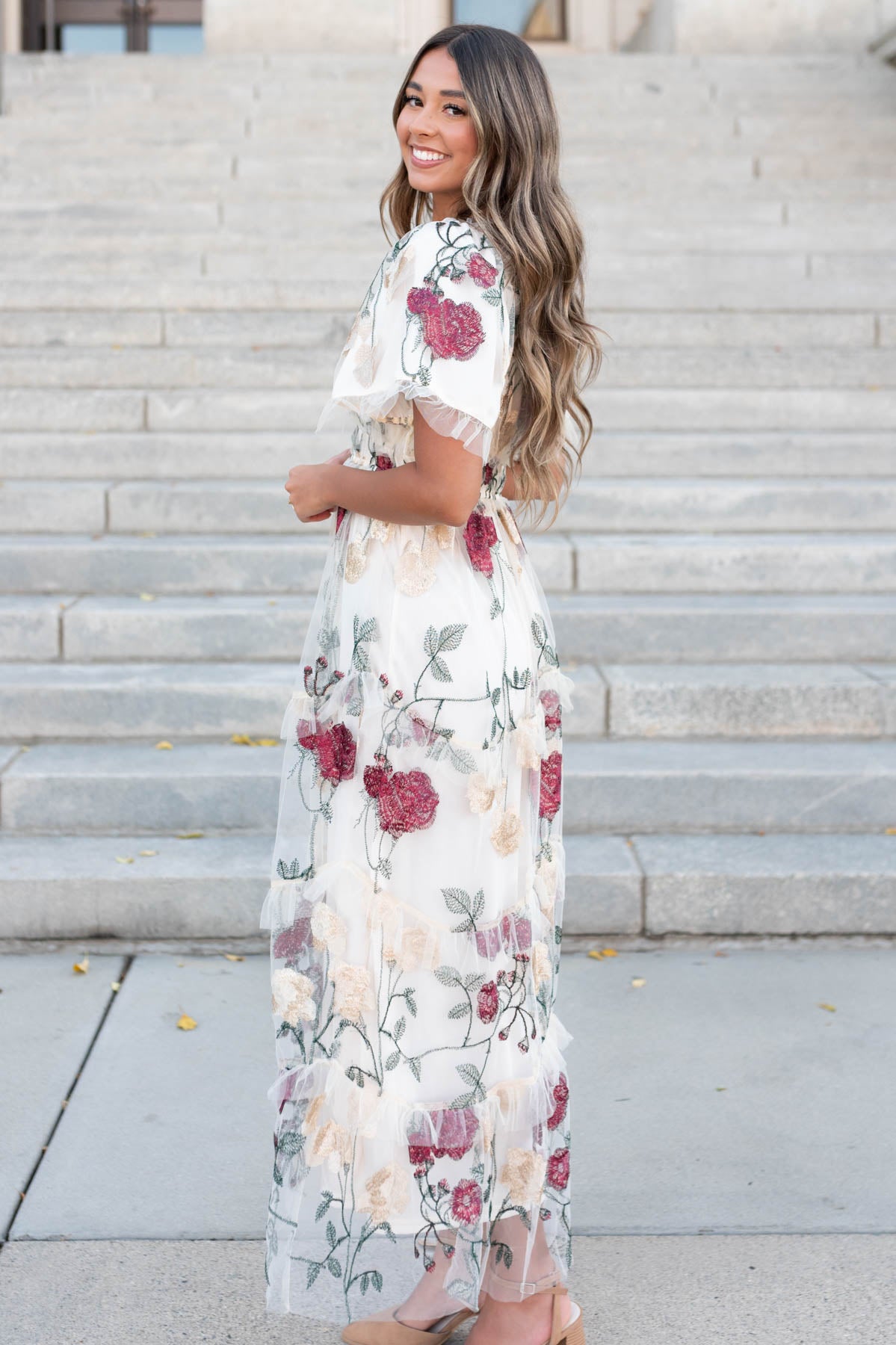 Side view of the cream floral mesh dress