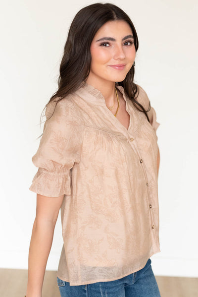 Side view of the taupe floral blouse