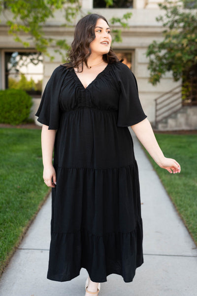 Plus size black tiered maxi dress with pockets