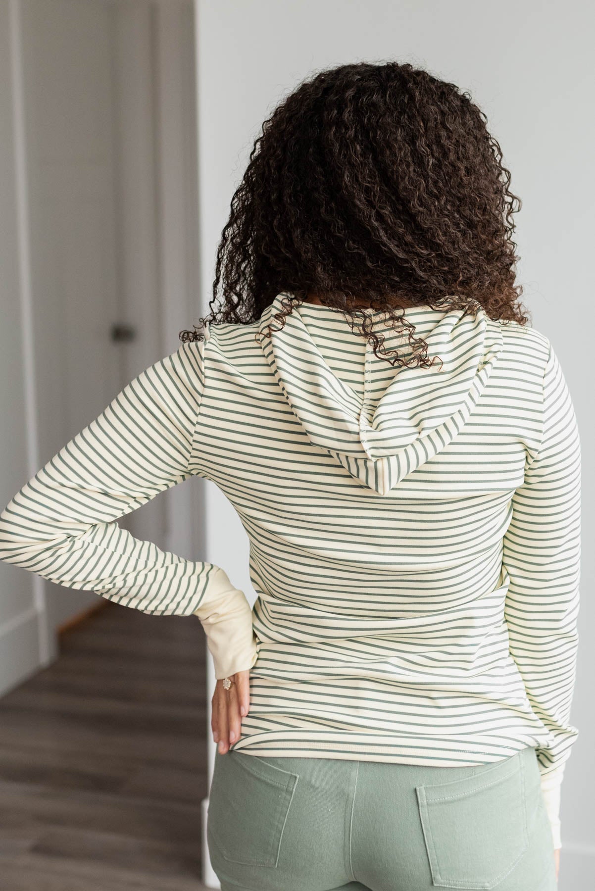 Back view of the green stripe hooded pullover