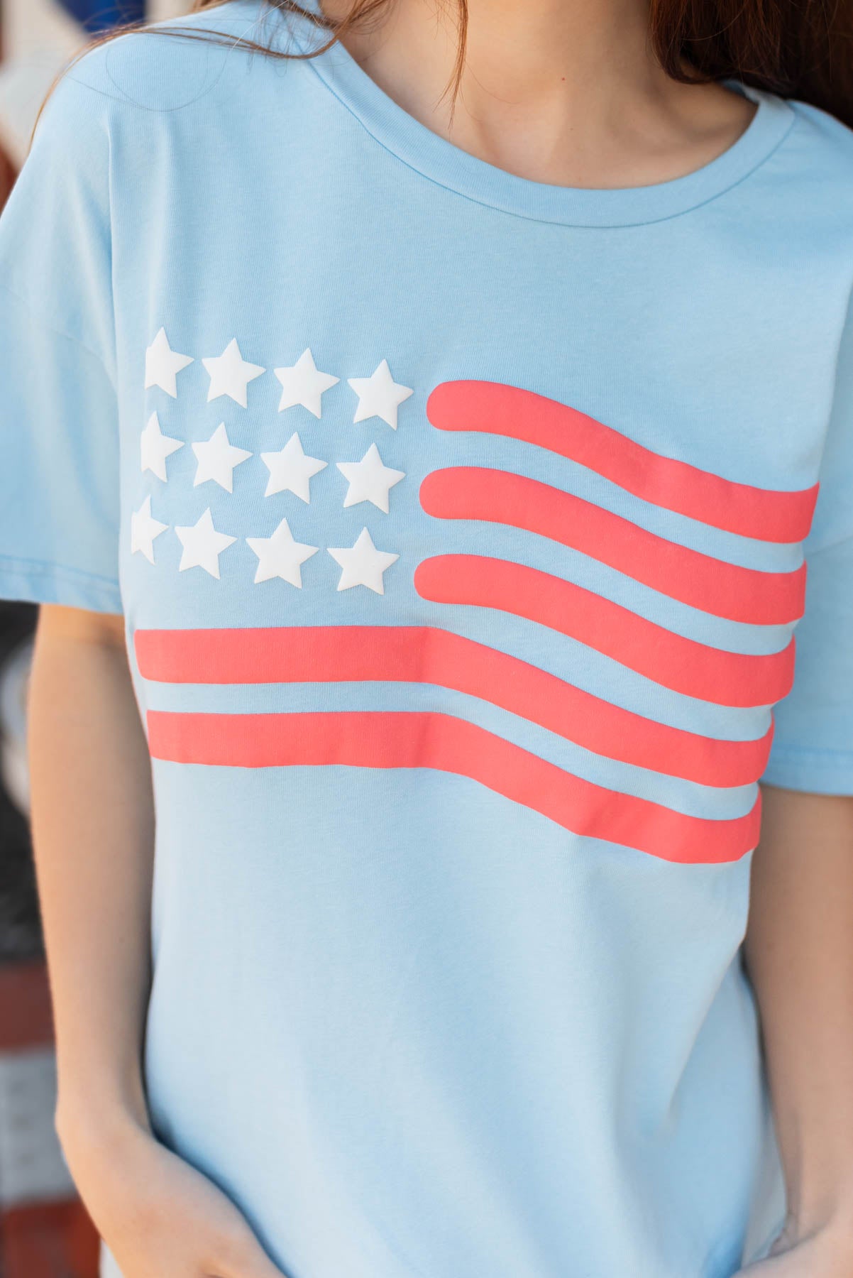 Close up of the flag on the light blue American flag top