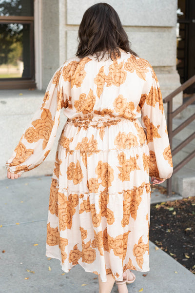 Back view of the plus size beige floral dress