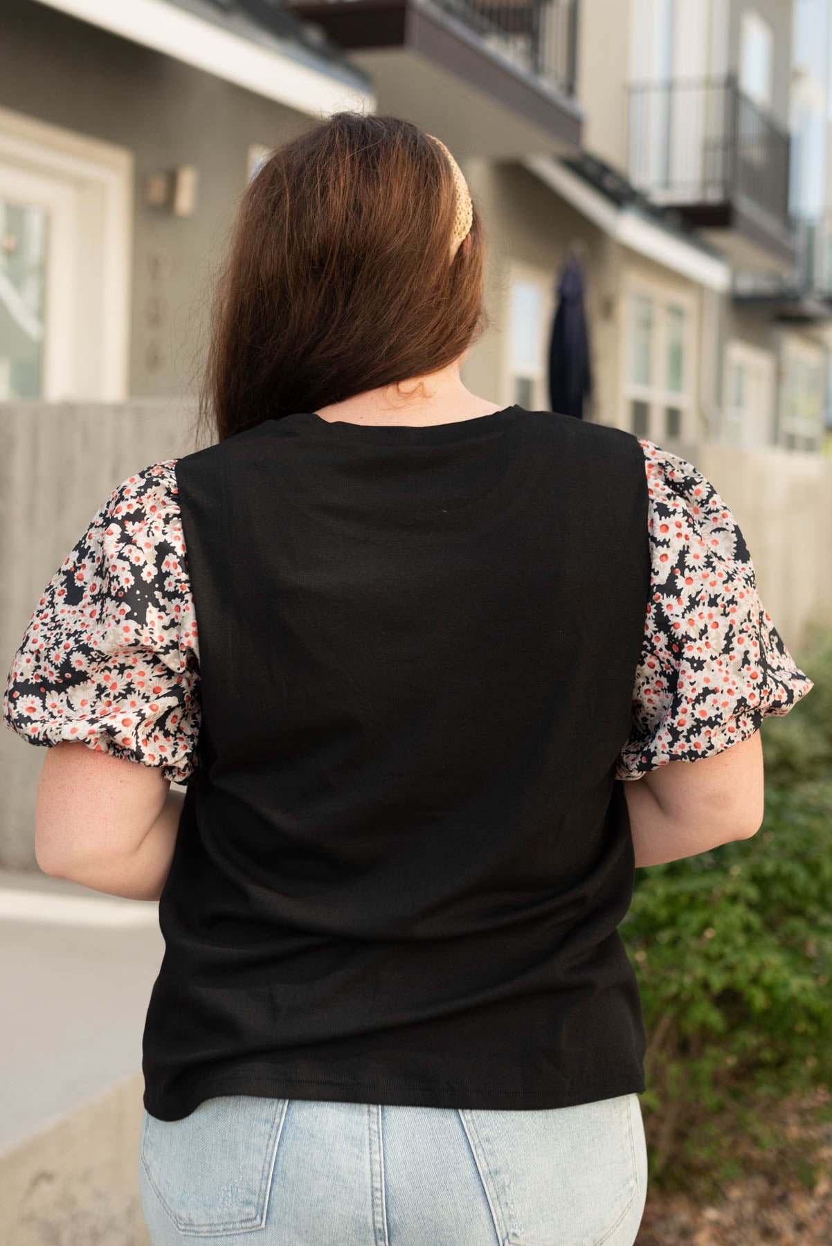 Back view of the black daisy print top