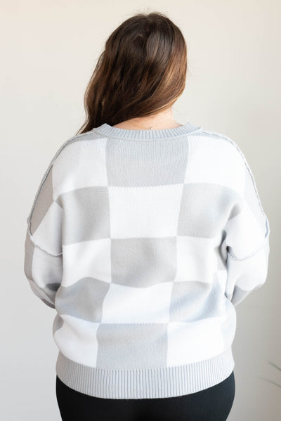 Back view of the plus size gray checkered sweater