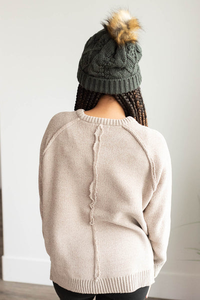 Back view of the taupe knitted sweater