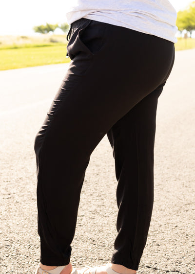 Side view of plus size black joggers