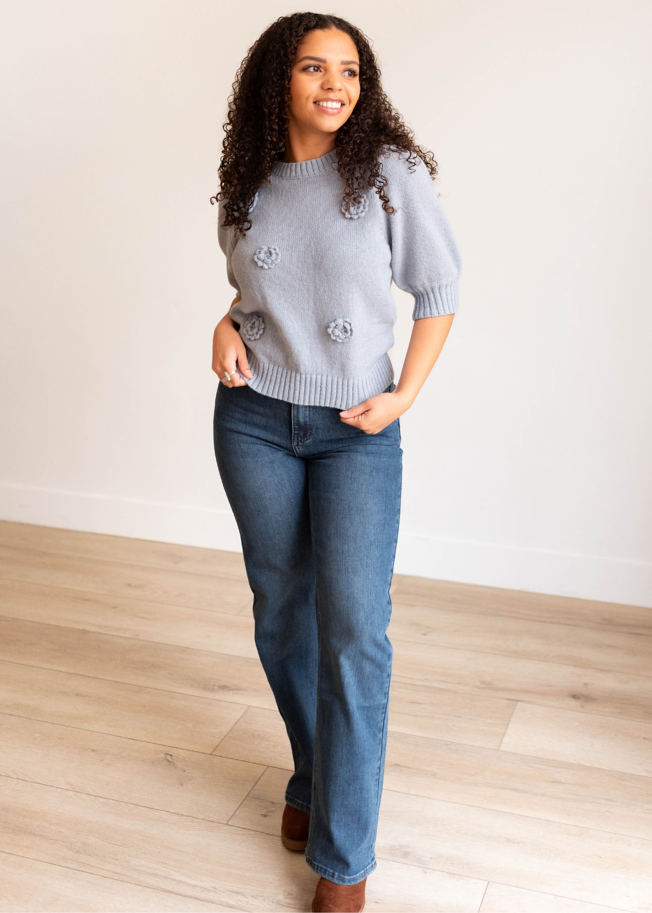 Front view of the dusty blue floral knit sweater