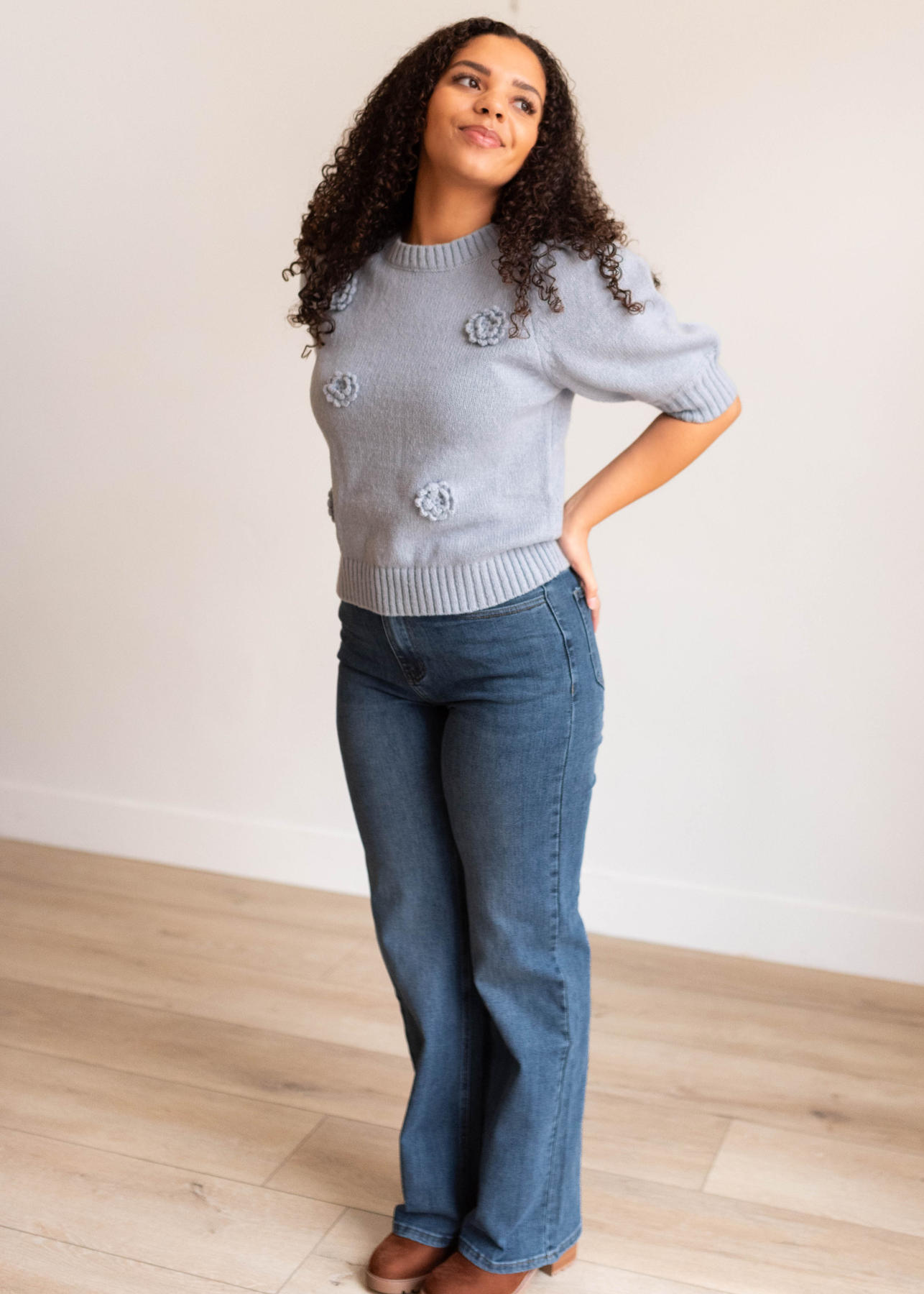 Short sleeve dusty blue floral knit sweater with sleeves that come to the elbow