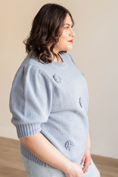 Side view of the dusty blue floral knit sweater in plus size