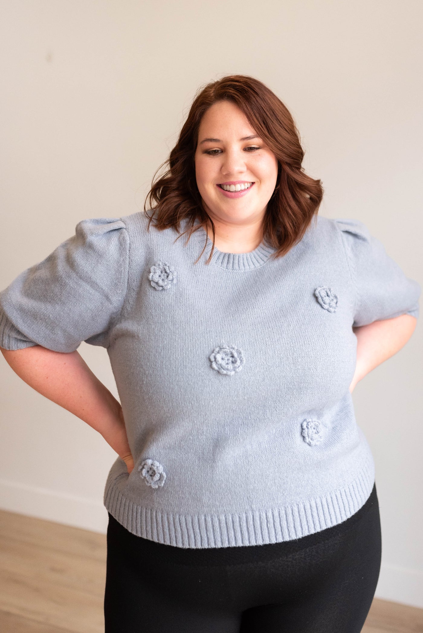 Front view of the plus size dusty blue floral knit sweater