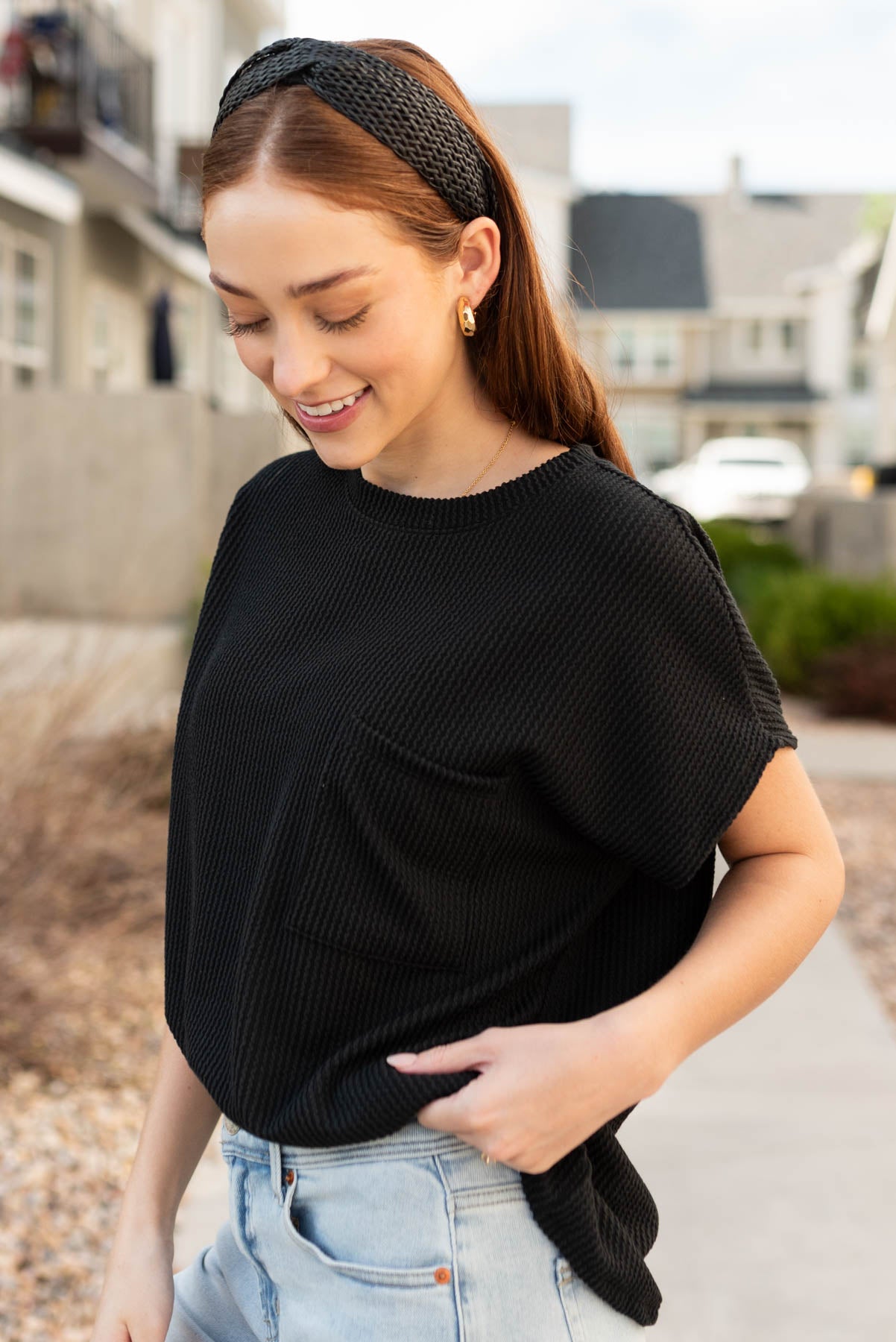 Side view of the black ribbed top