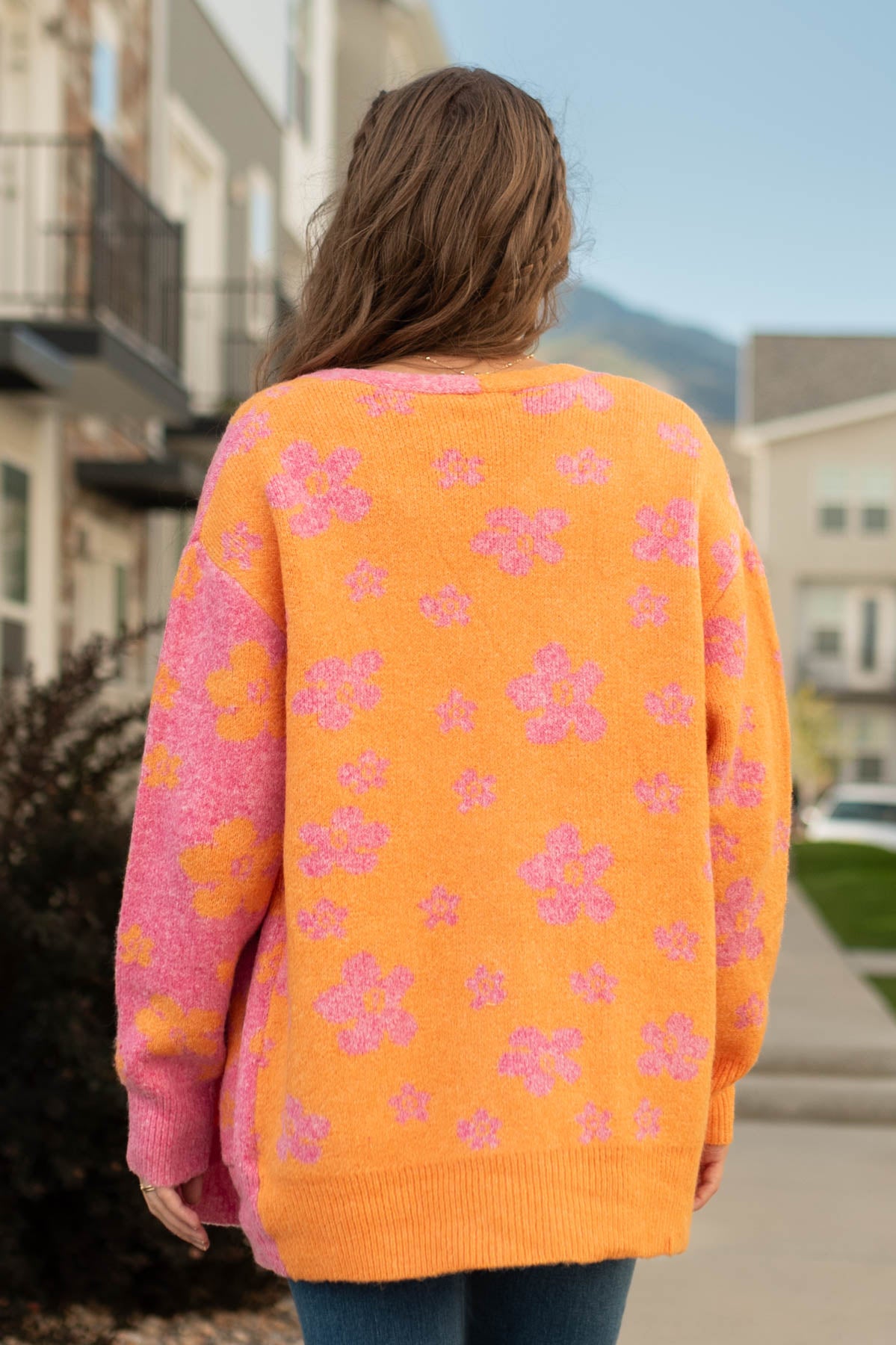 Back view of a orange cardigan