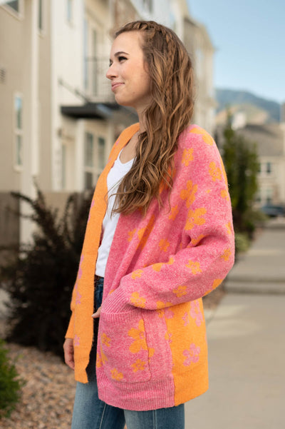 Pick side of a orange cardigan