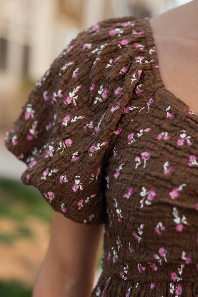 Close up of the fabric on the brown floral dress