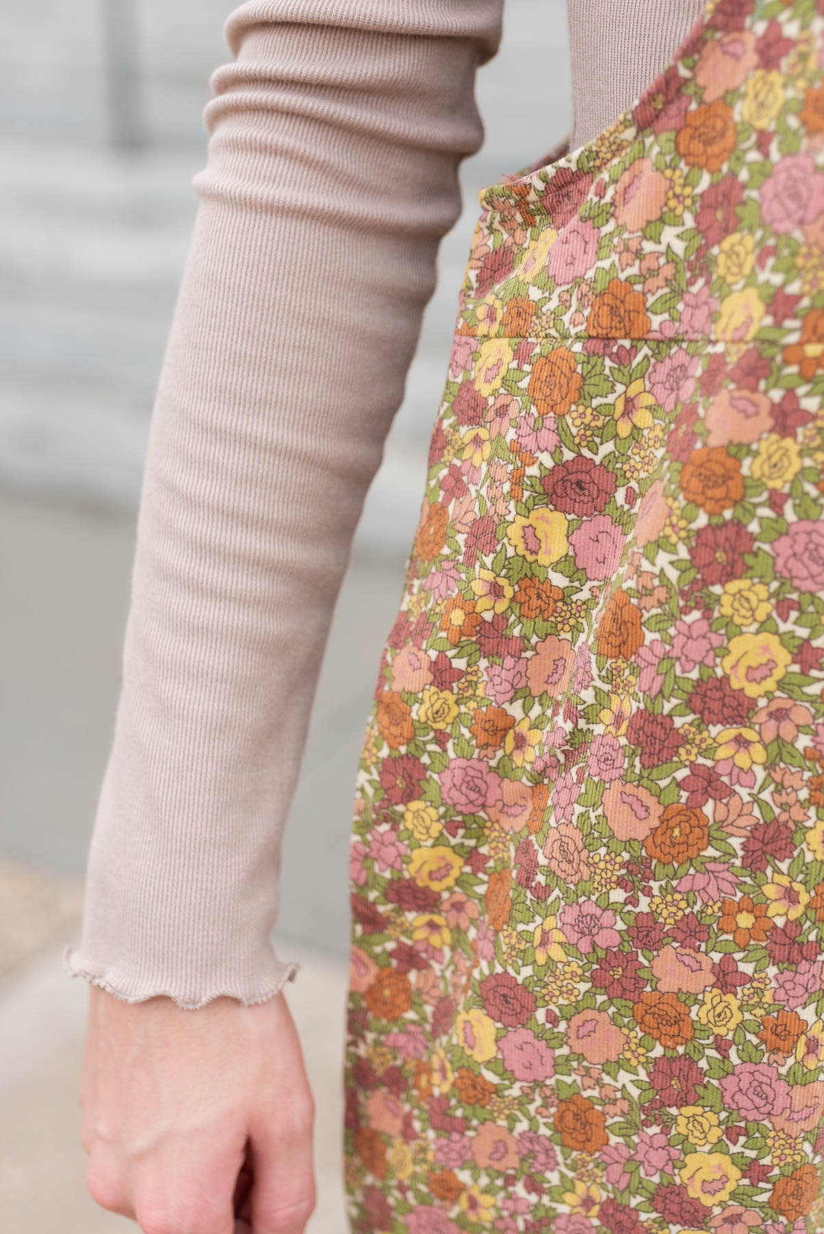 Close up of the print on the marsala floral overalls