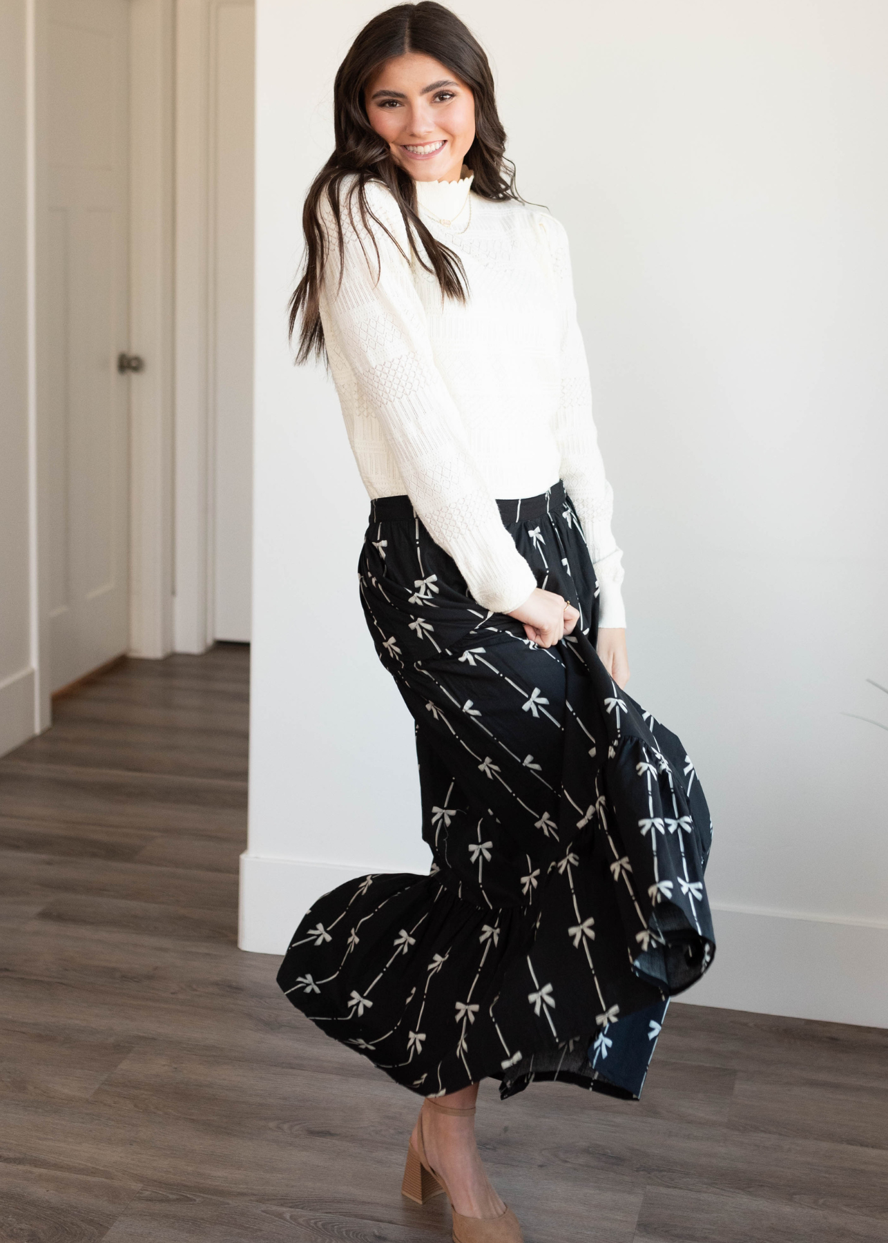 Side view of the black bow printed skirt