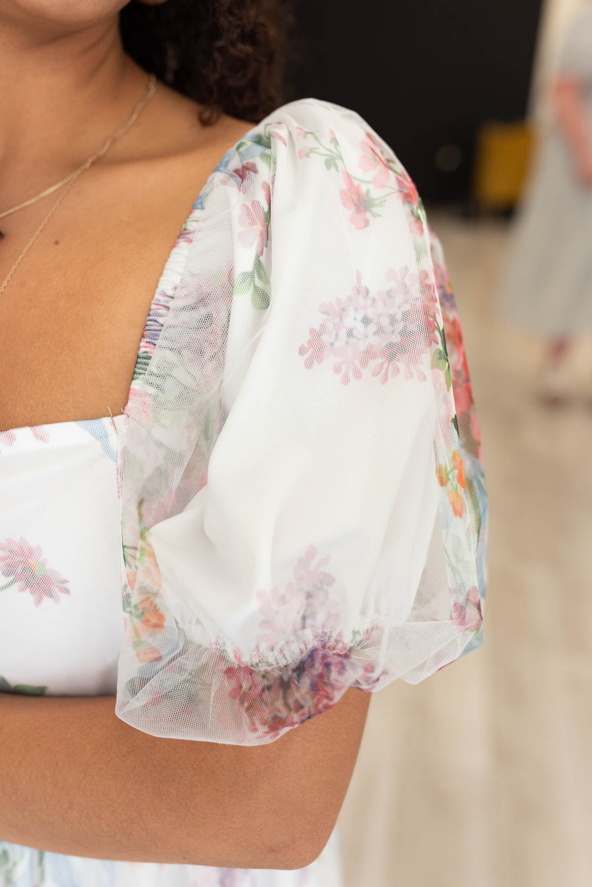 Close up of the sleeve and fabric on the ivory tulle sqare neck dress