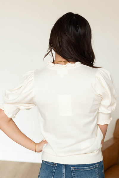 Back view of the ivory puff sleeve sweater