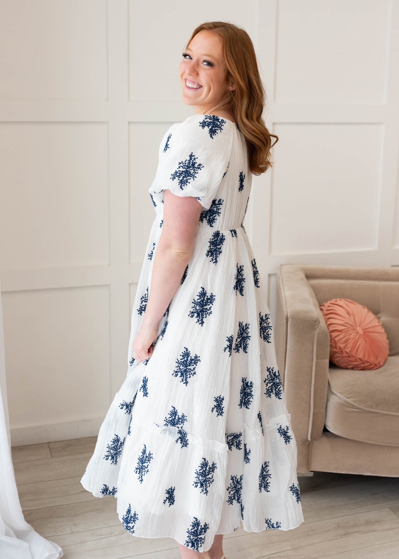 Side view of the ivory embroidered dress