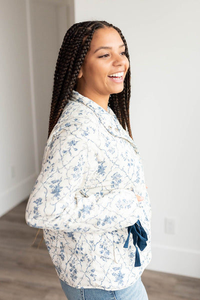 Side view of the cream floral printed jacket