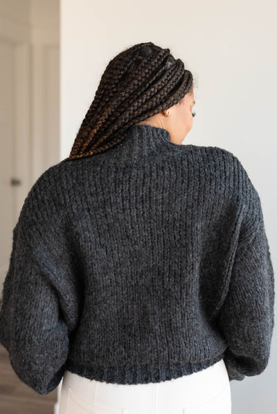 Back view of the black knit sweater