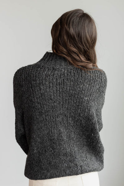 Back view of the black knit sweater