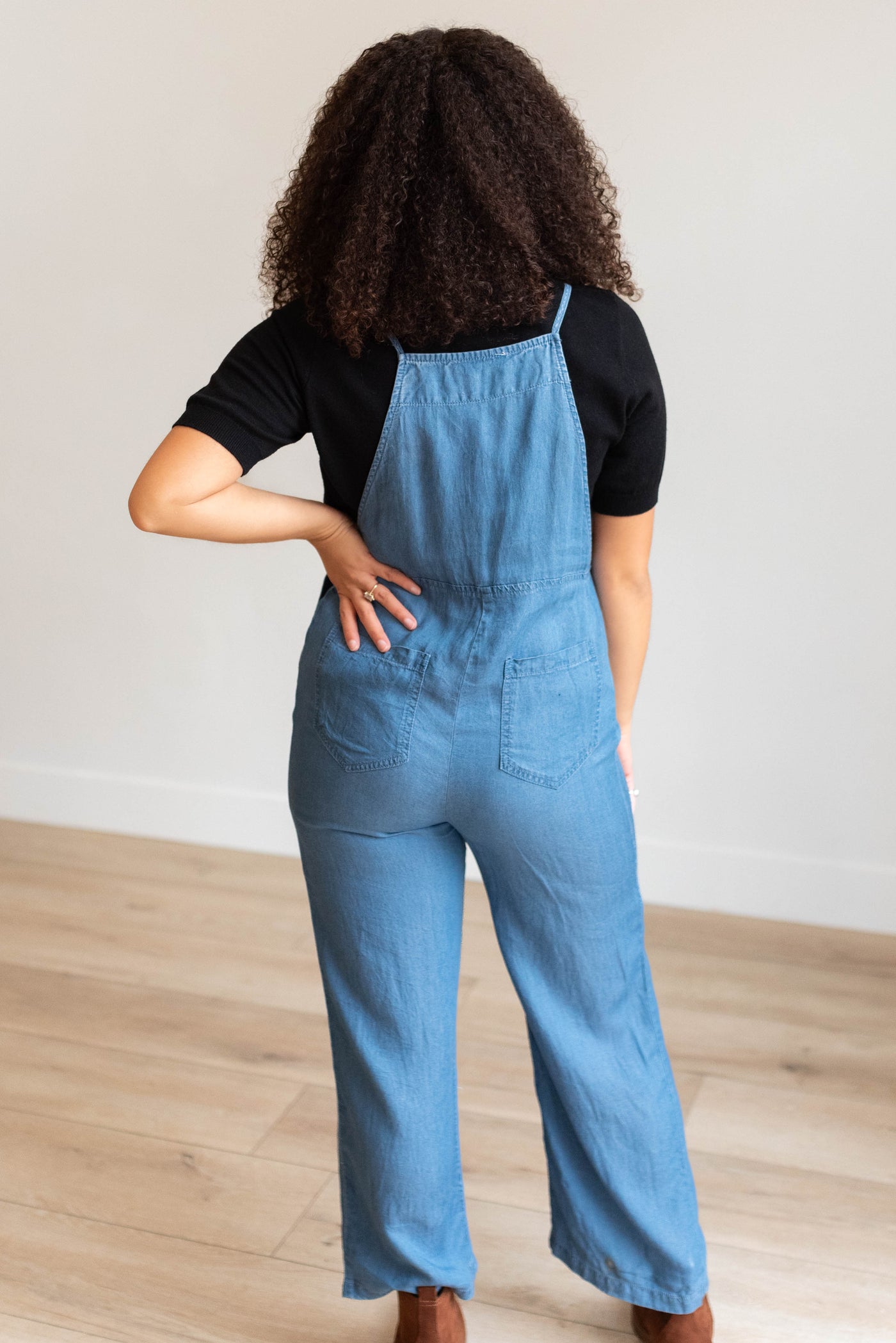 Back view of the indigo washed jumpsuit