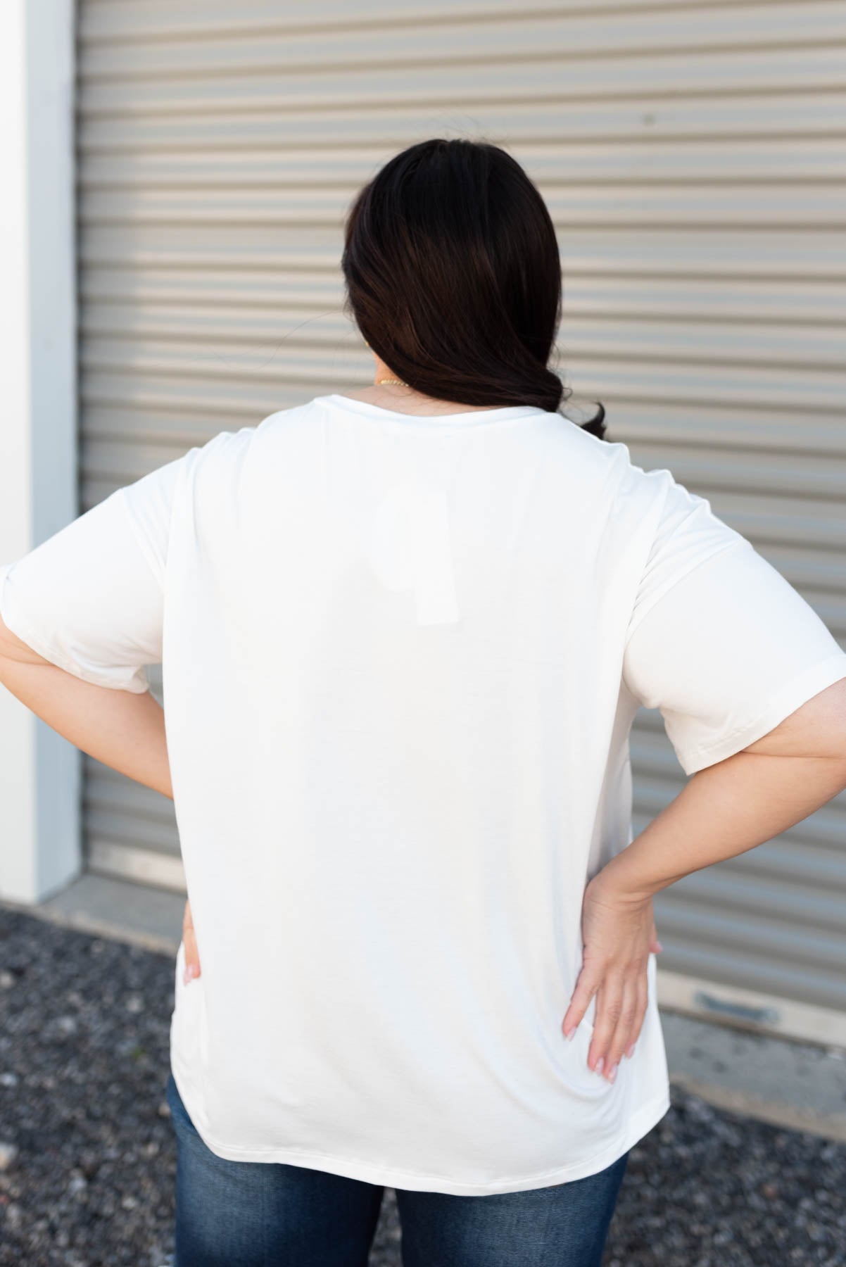 Back view of the plus size white American graphic tee