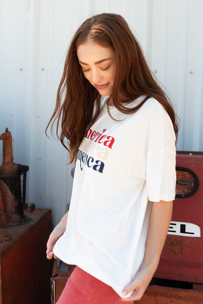 Side view of the white America graphic tee