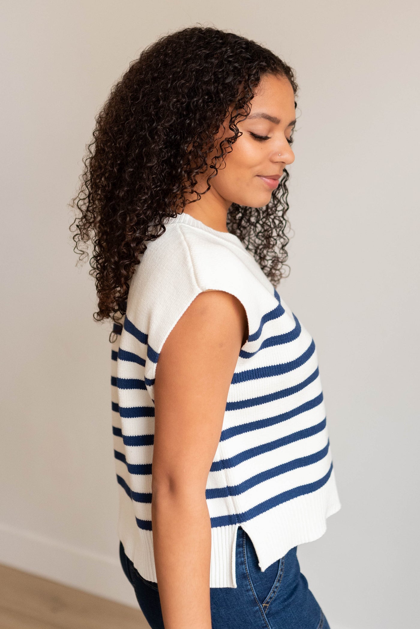 Side view of the light navy stripe sweater vest