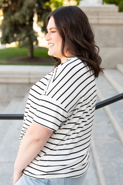 Side view of the ivory stripe oversize top