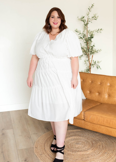 Short puff sleeves on the ivory v neck dress in plus size