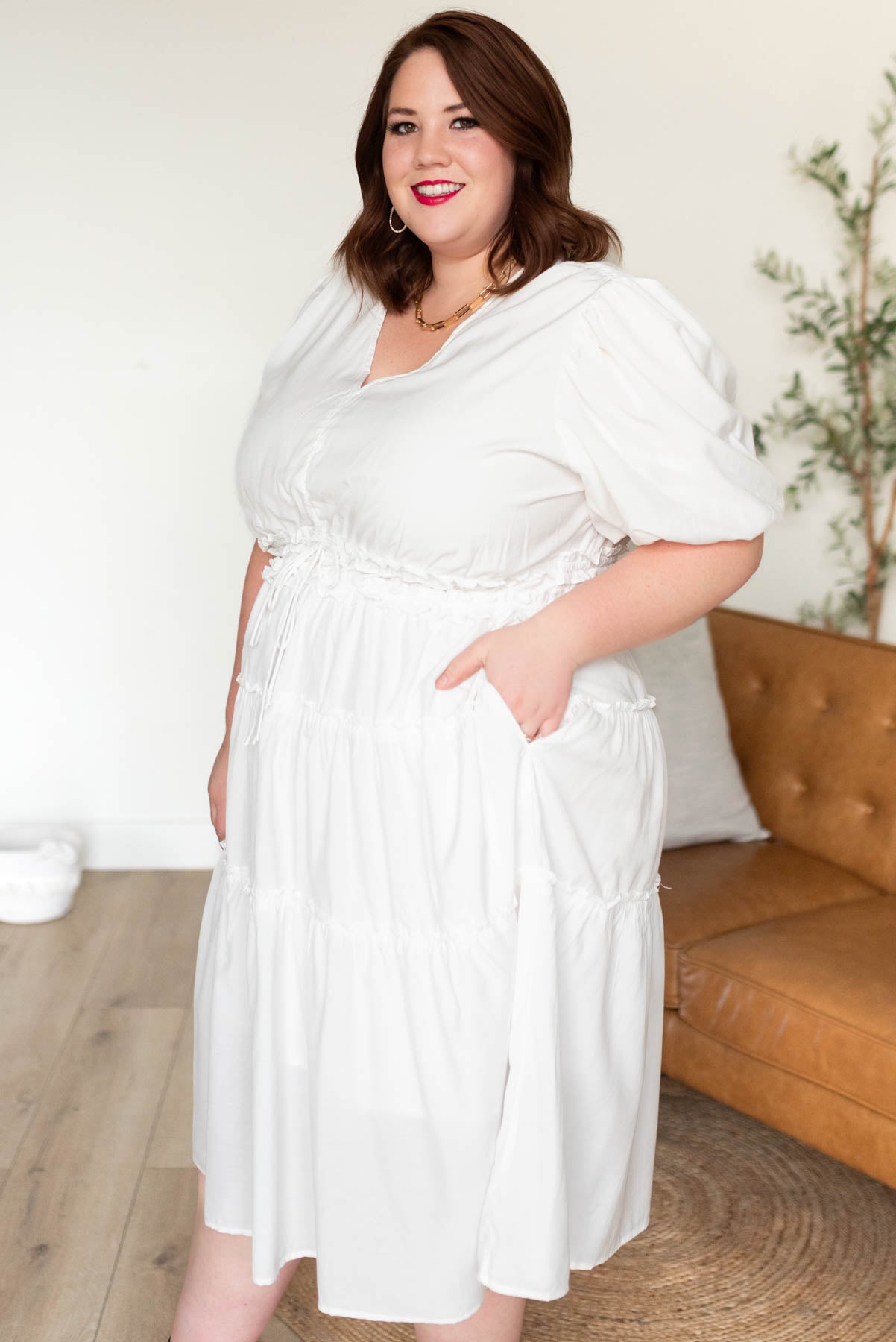 Side view of the plus size ivory v neck dress in plus size