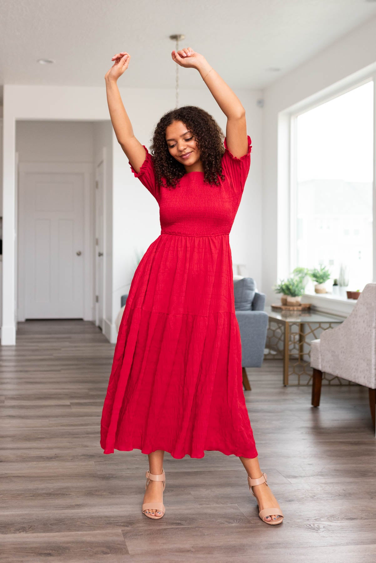 Red smocked dress with short sleeves and smocking on the top